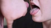 Stringy cum shot on her tongue.