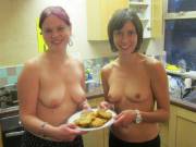 Topless friends in the kitchen