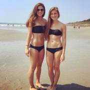 Sisters in matching black bikinis