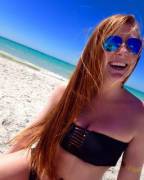 Happy redhead at the beach