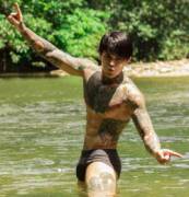 Tattooed guy in the water (X-Post /r/wetmale)
