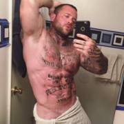 Tattooed muscle guy