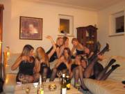 9 pairs of legs in black pantyhose at a party