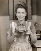 This vintage girl is eager to show off her neat pie