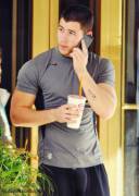 Muscular guy on the phone