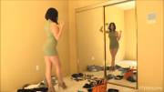 Amanda Aimes getting ready in front of mirror