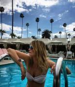 Mischa Barton pokin out in the pool.