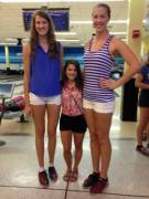 2 volleyball players, 1 cheerleader