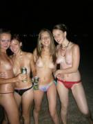 Nighttime topless beach party
