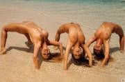 Three playful (and nude) beach beauties