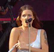 Tove Lo flashing a boob during a concert
