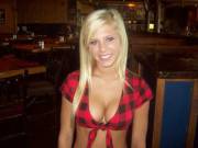 Barmaid in a plaid shirt.