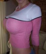 Pink and white sweater.