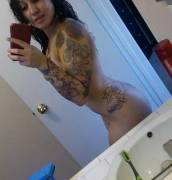 stripper with a sleeve tattoo