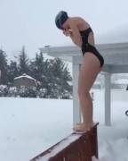 Girl with swimmer's body dives into snow