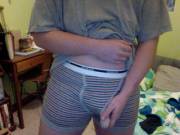 Bulge and reveal in striped boxer briefs