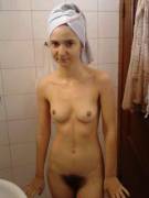 young bushy girl nude with towel on head