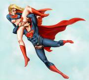 Superman giving Supergirl some "mid flight entertainment" (Topoodo)