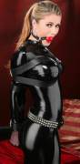 Blonde in catsuit gagged and bound with straps