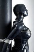 Encased in latex and tied to a pole