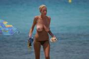 Big breasts topless beach