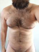Wild beard and a hairy chest.