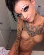 Tough with tats and tight abs. she will break you in half