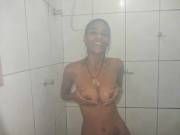 Holding her tits in the shower