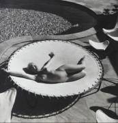 Andre De Dienes - Marilyn Monroe lying naked on a trampoline, 1953