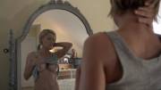 Kathleen Robertson looking at her tits in the mirror