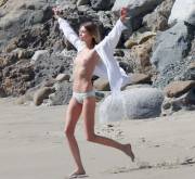 Stella Maxwell topless on the beach shooting Victoria's Secret ad