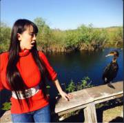 Hitomi Tanaka in a red sweater while visiting south Florida for a photo shoot.