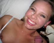 Happy teen with jizz on her face. (NSFW)