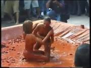 Two Topless Girls Wrestle in Clay