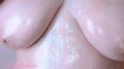 glitter oil all over huge boobs
