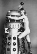 Doctor Who companion "Jo Grant" (actress Katy Manning) snuggles up to a Dalek