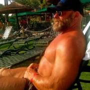 Bearded powerlifter daddy in the sun.