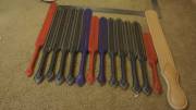A variety of tawses and a large strap waiting for the next stage of finishing work.