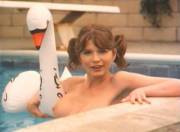 in the pool with her swan