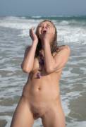 Naked beach babe with gorgeous bush