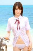 Wet at the beach in shallow area with uniform and a bike? Not sure how such a scenario happens.  Suzumura Airi