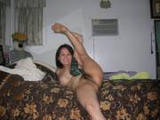 Flexible Asian milf showing off some juicy hairy Asian pussy.