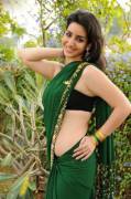 Kriya knows how to wear a saree and yet show some skin [ALBUM]