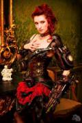 Is it the corset, or the gun, or the red hair?