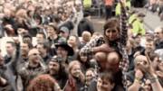 Flannel-clad girl flashing in a crowd