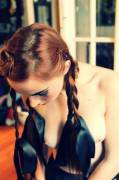 Topless redhead with braids