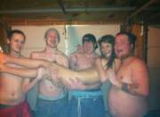 This has the makings of a great gangbang, thin brunette naked being held by four shirtless smiling guys