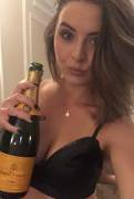 Gripping the champagne bottle like she knows what to do