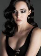 Emma Stone's black hair and nice cleavage