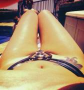 Awesome shot of a girl wearing her chastity belt while sun bathing